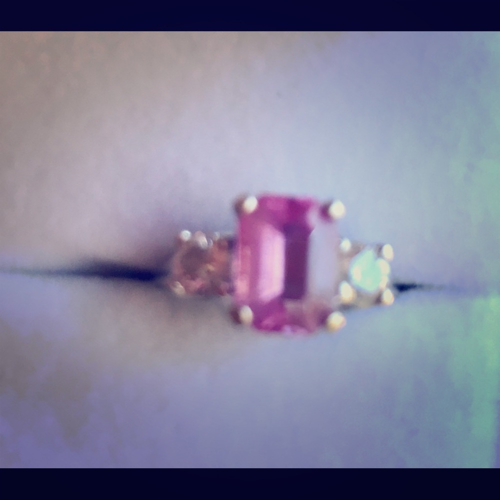 Natural Pink Sapphire with 2 1/2 k each diamonds.